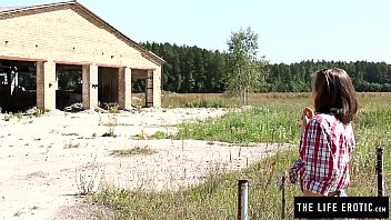 Sexy cougar fucking herself hard in a collapsed building while tied with ropes