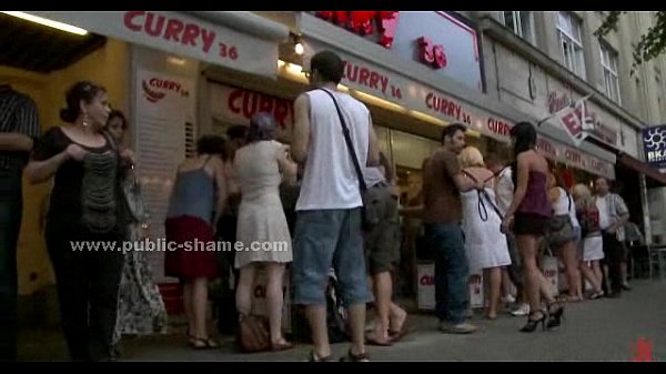 Sexy babe in dress tied in public and tormented with bondage device