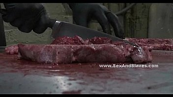 Butcher enjoys slut hung from ceiling